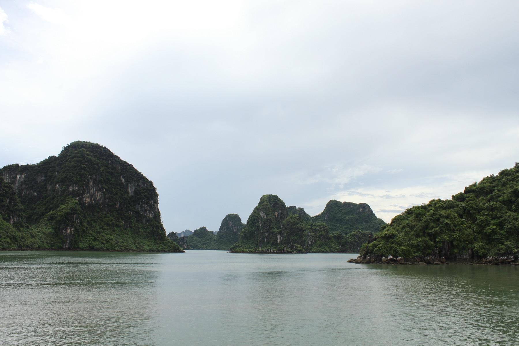 Limestone karsts rising from the emerald water of Hạ Long Bay